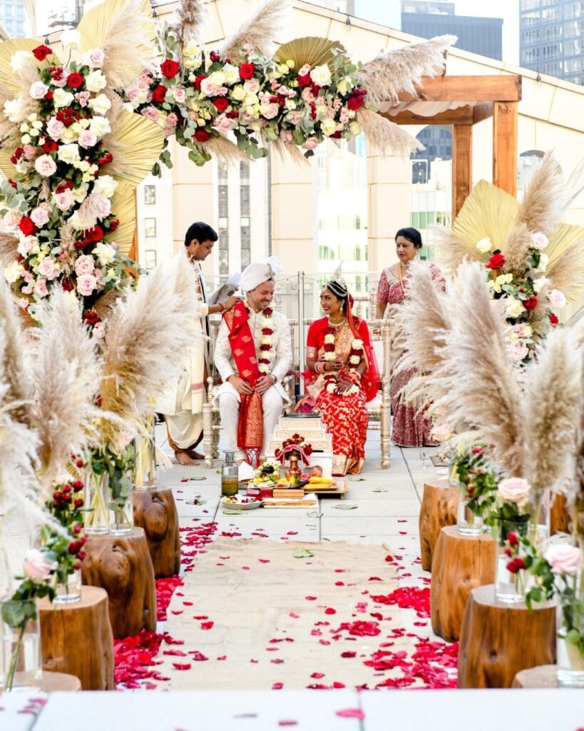 Elegant mandap design with flowers and drapes for Indian Wedding Decor