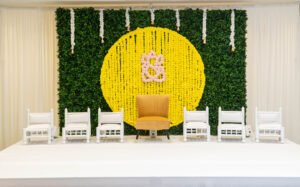 Groom’s Pithi ceremony decorated with vibrant marigold flowers at Puja and Kushal’s Indian wedding at Hartford Marriott

