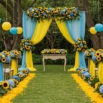 Elegant yellow and blue wedding decor featuring floral centerpieces, draping, and a beautifully wrapped floor.