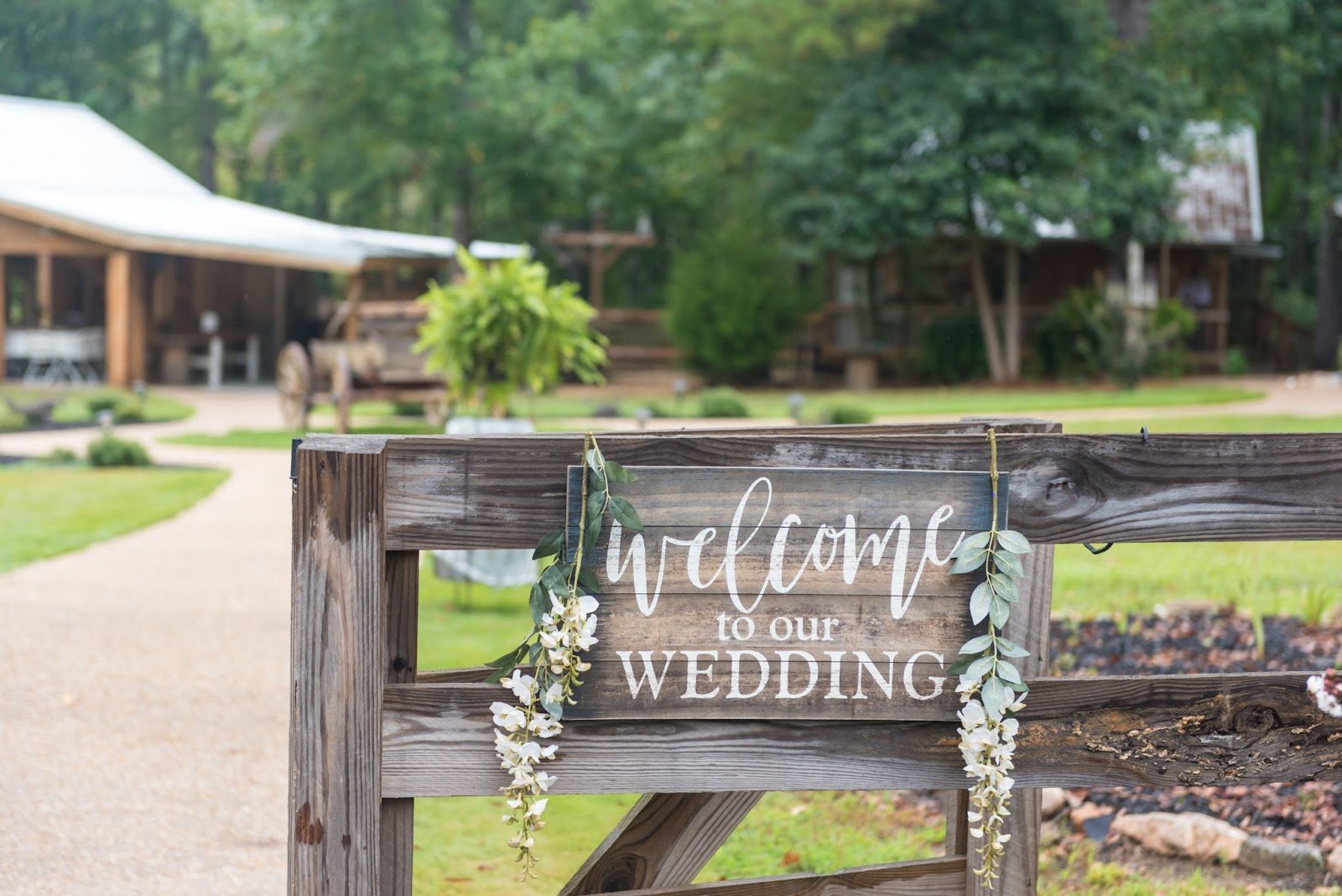 viking themed wedding decor
decoration with a wooden "Welcome to Our Wedding" sign adorned with white flowers.