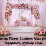 Beautiful engagement stage with a lavish floral backdrop, featuring pastel blooms, cascading drapes, and ambient lighting for a romantic wedding setting.
