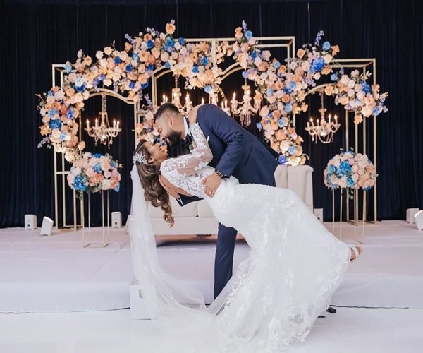 judi and cris Hand-in-hand couple in a stunning aisle arrangement designed by Elegantize, featured in their wedding coordinator portfolio