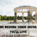 Elegant wedding ceremony setup with floral aisle decorations, draped altar backdrop, hanging ceiling florals, and romantic lighting in a luxury wedding venue