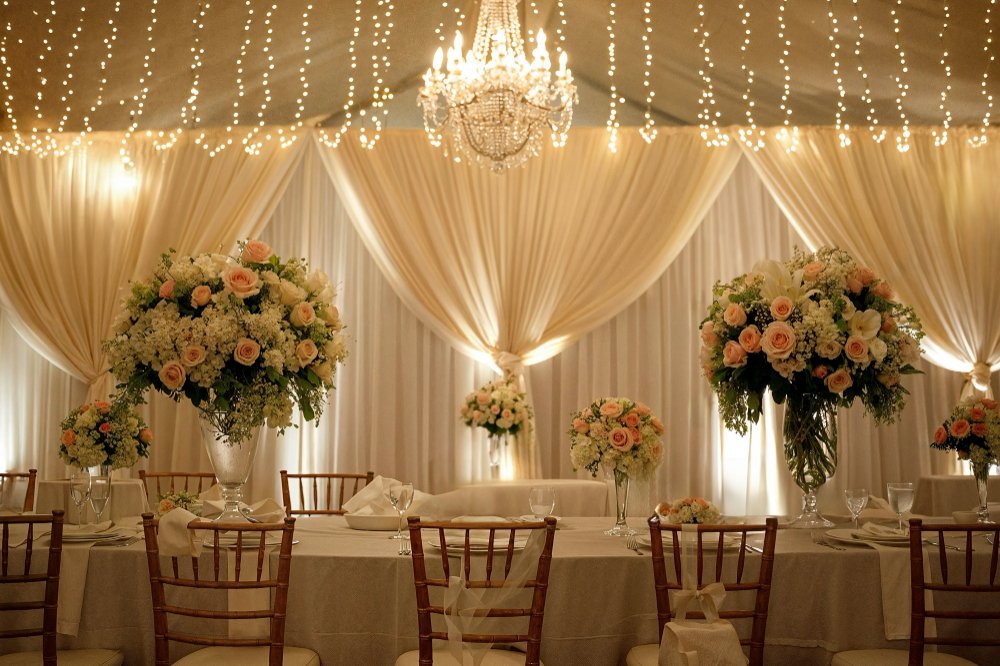 Indoor wedding reception decor matching ceremony theme, elegant table centerpieces
