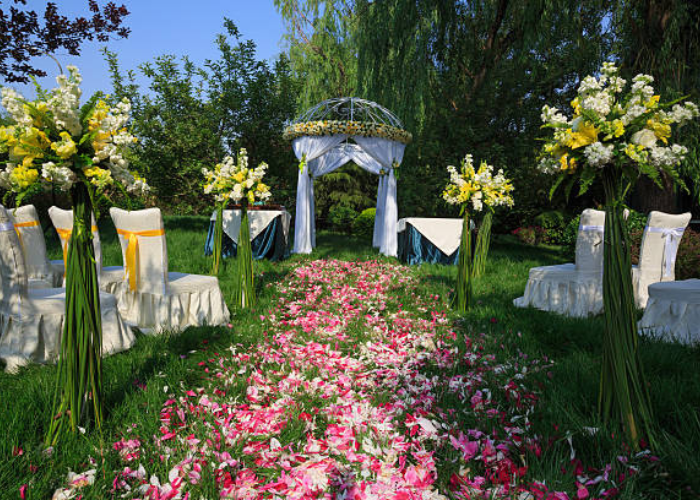 Silk flower arrangements vs fresh flowers side-by-side at wedding ceremony