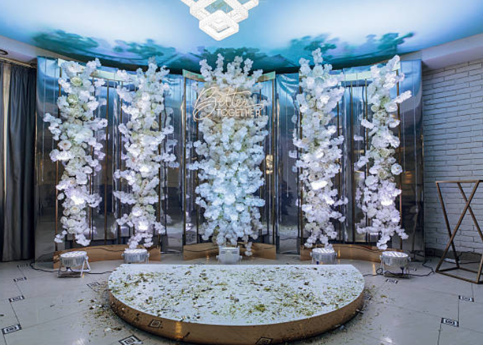 Elegant wedding table setup showing silk flower arrangements vs fresh flowers