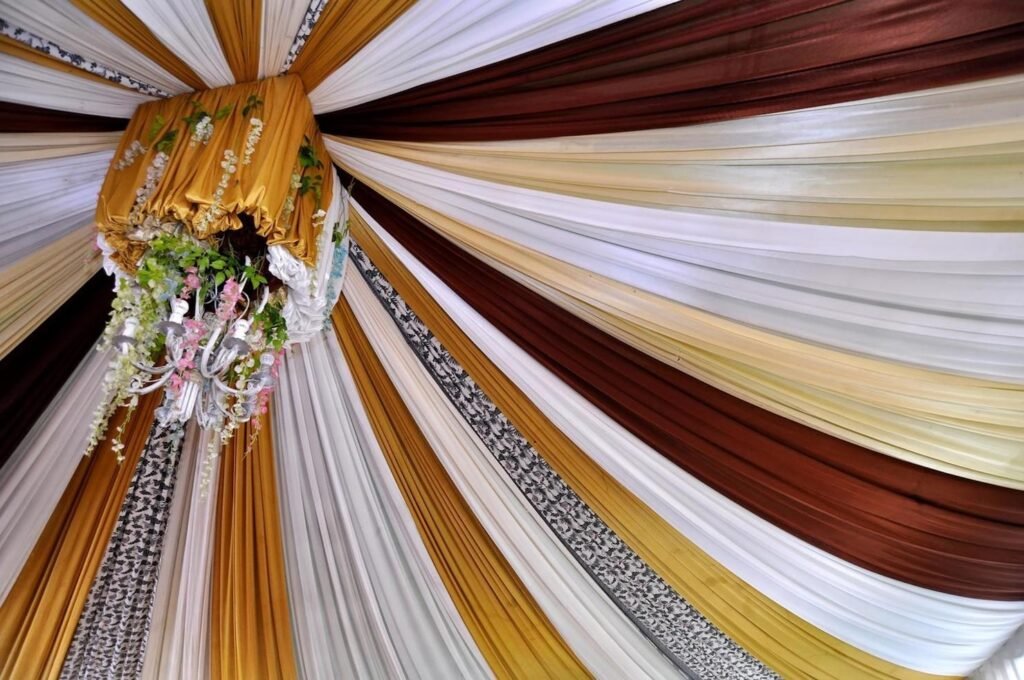 Elegantize team designing and installing ceiling drapes with fairy lights — from concept sketch to final glowing wedding ceiling setup Elegantize team designing and installing ceiling drapes with fairy lights — from concept sketch to final glowing wedding ceiling setup