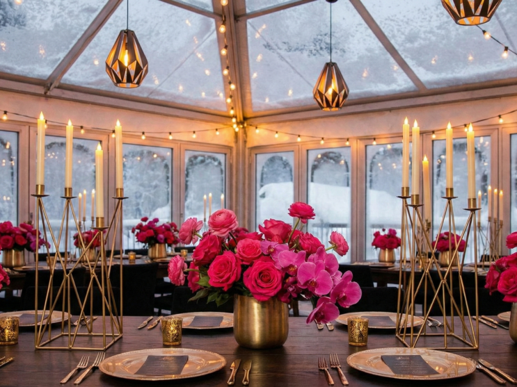 Hot pink winter wedding decor with bold florals and gold details.